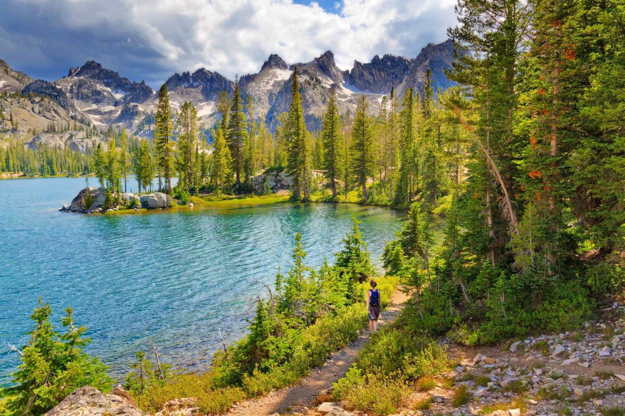 Female hiker along shores of Alice Lake, Idaho