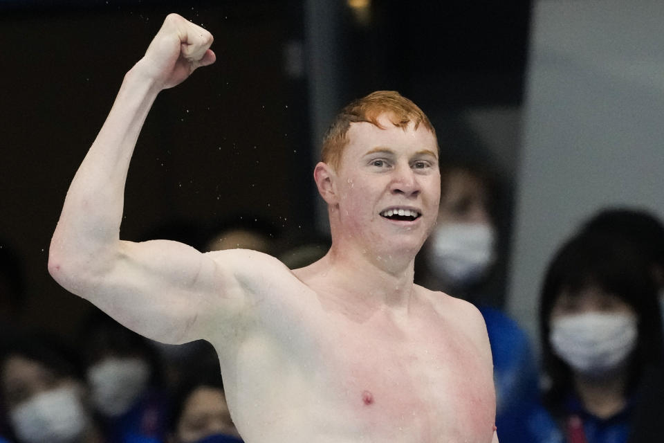 Tom Dean, of Britain, celebrates after winning the final of the men's 200-meter freestyle at the 2020 Summer Olympics, Tuesday, July 27, 2021, in Tokyo, Japan. (AP Photo/Petr David Josek)