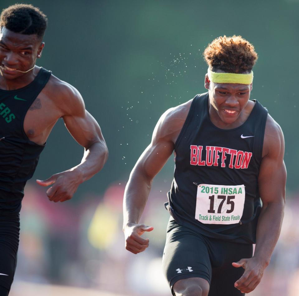 John Hankerson (left), of South Bend Washington High School, nips second place finisher D'Wayne Eskridge of Bluffton High School at the line for the 100 meter title, IHSAA Boys Track and Field Finals, Indiana University, Bloomington, Friday, June 5, 2015. 