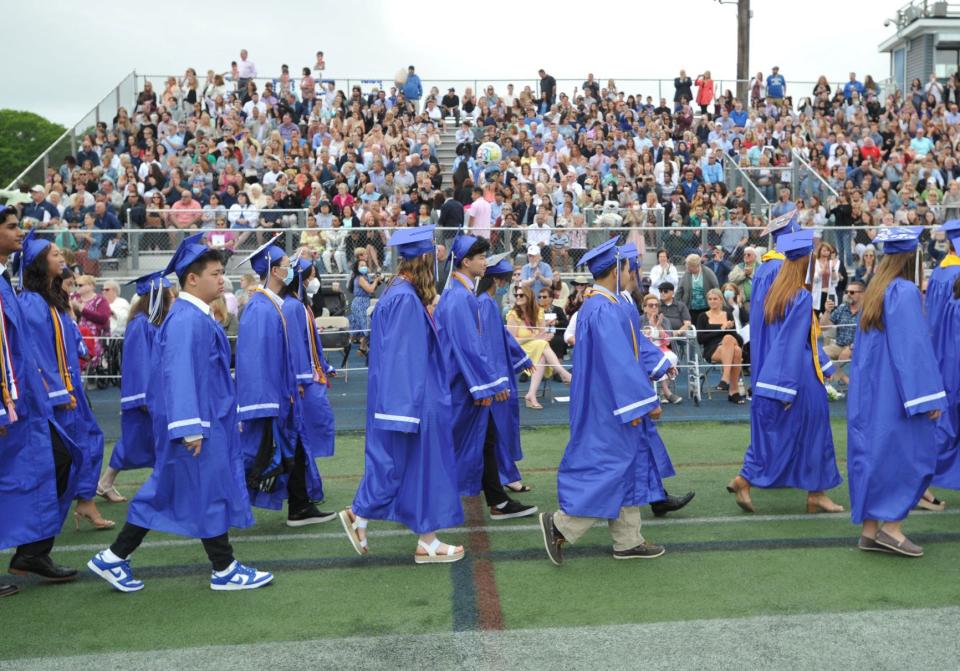 The graduating seniors' procession passes by their families during the Braintree High School graduation Saturday, June 4, 2022.