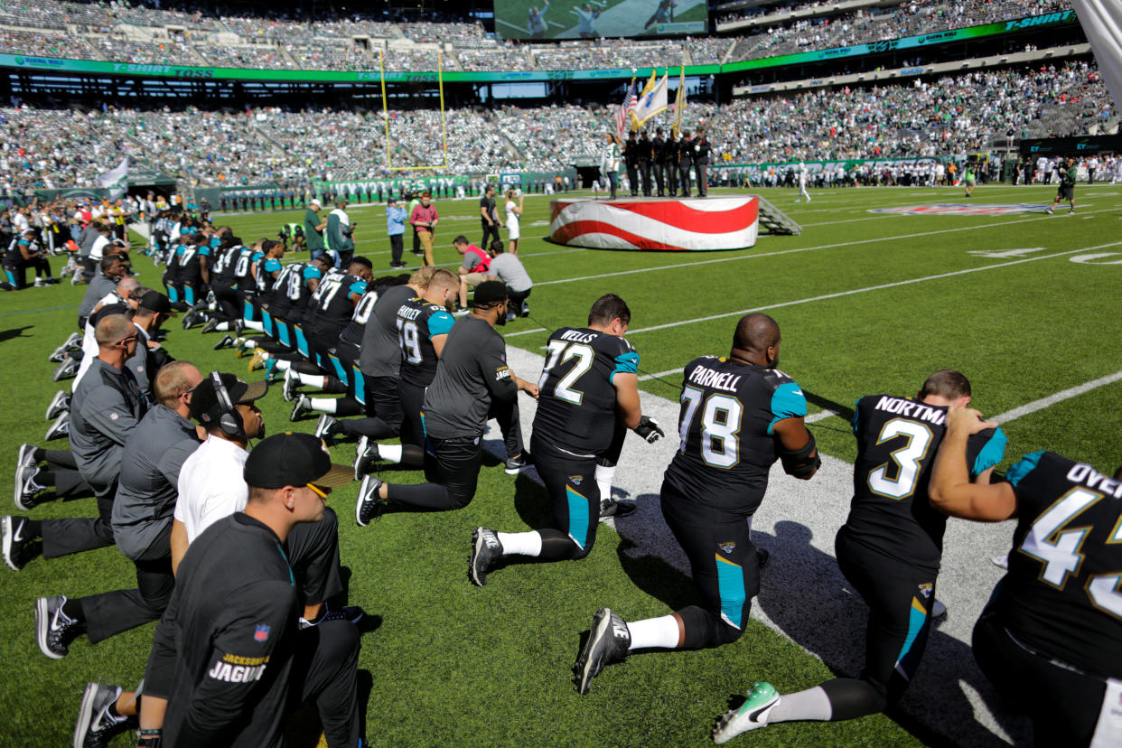 Jacksonville Jaguars players kneel before the national anthem before their NFL football game against the New York Jets in East Rutherford, New Jersey, U.S. October 1, 2017. REUTERS/Eduardo Munoz