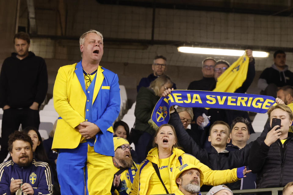 Sweden supporters wait on the stands after suspension of the Euro 2024 group F qualifying soccer match between Belgium and Sweden at the King Baudouin Stadium in Brussels, Monday, Oct. 16, 2023. The match was abandoned at halftime after two Swedes were killed in a shooting in central Brussels before kickoff. (AP Photo/Geert Vanden Wijngaert)