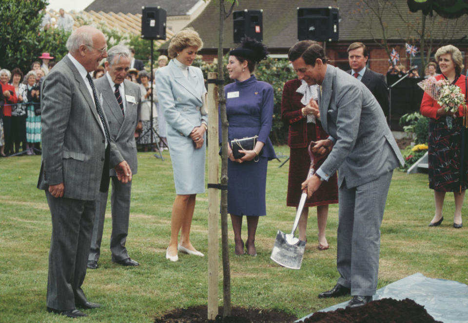 Prince Charles and Diana, Princess of Wales planting a tree in Chester, England, May 1988. Diana is wearing a suit by Arabella Pollen.<span class="copyright">Terry Fincher/Princess Diana Archive—Getty Images</span>