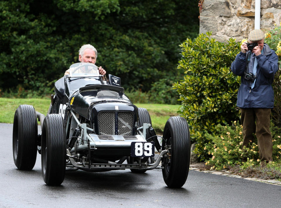 A 1924 Bentley driven by Jock Mackinnon races past Duchess Anne Cottages on the Kinneil Estate at a preview of the forthcoming Bo'ness Speed Hill Climb being held there on Saturday 12th and Sunday 13th September. More than 120 classic cars and motorbikes from across the Uk will be blistering up Scotland's oldest permanent racetrack. 