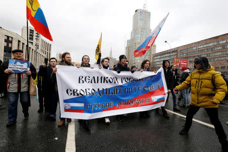 People attend a rally to protest against tightening state control over internet in Moscow, Russia March 10, 2019. The banner reads: "Great Russia, Free internet”. REUTERS/Shamil Zhumatov