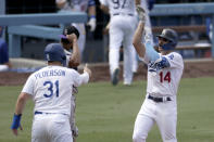 Los Angeles Dodgers' Enrique Hernandez, right, celebrates with Joc Pederson, front left, after hitting a three-run home run as Colorado Rockies catcher Elias Diaz, back left, looks away during the fourth inning of a baseball game in Los Angeles, Sunday, Aug. 23, 2020. (AP Photo/Alex Gallardo)