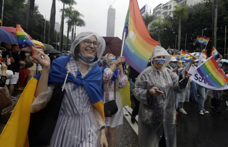 Participants revel through a street during the annual Taiwan LGBT Pride parade in Taipei, Taiwan, Saturday, Oct. 29, 2022. (AP Photo/Chiang Ying-ying)