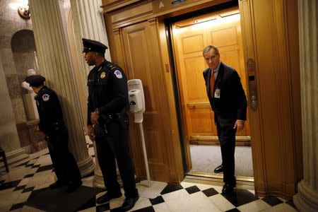 U.S. Capitol security hold the elevator as senators attend a vote a the Senate Chamber at the U.S. Capitol in Washington, January 20, 2016. REUTERS/Carlos Barria