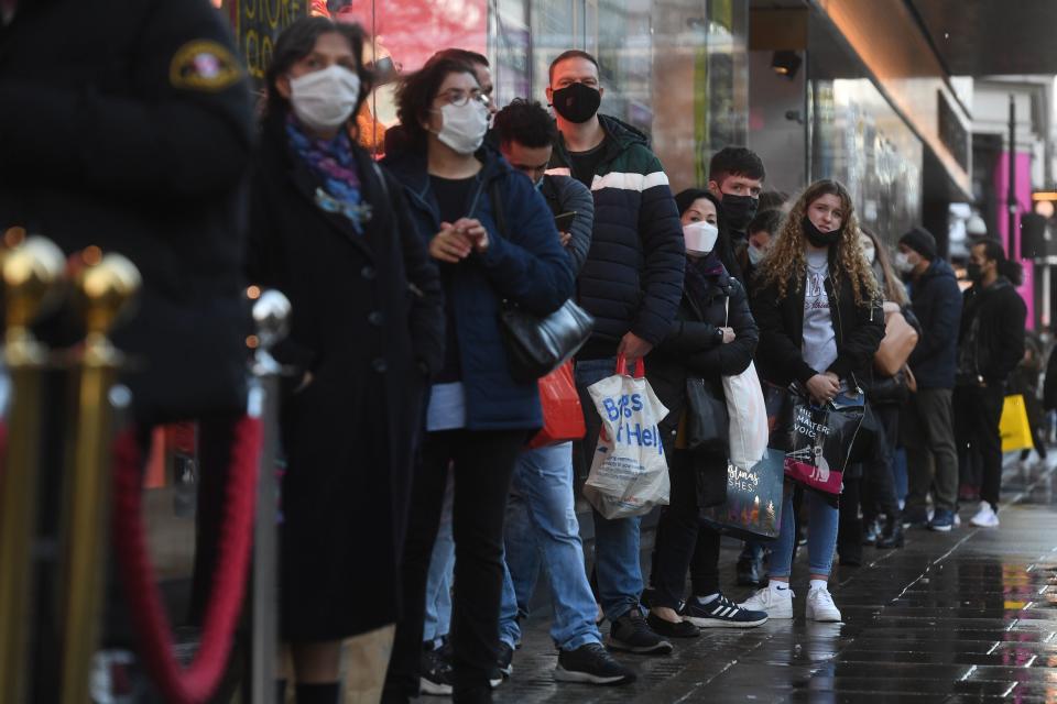 <p>People shopping on Oxford Street in central London </p> (PA)