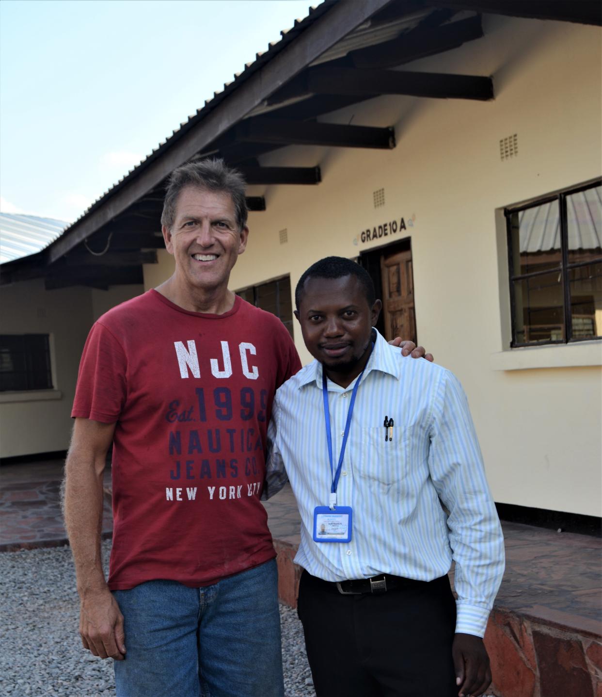 Martin Gottschling, left, poses with Bertrand Fwota, the headmaster of Lifesong Harmony School in Zambia.