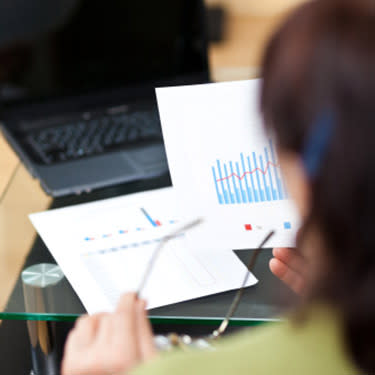 Woman-working-on-financial-reports_web