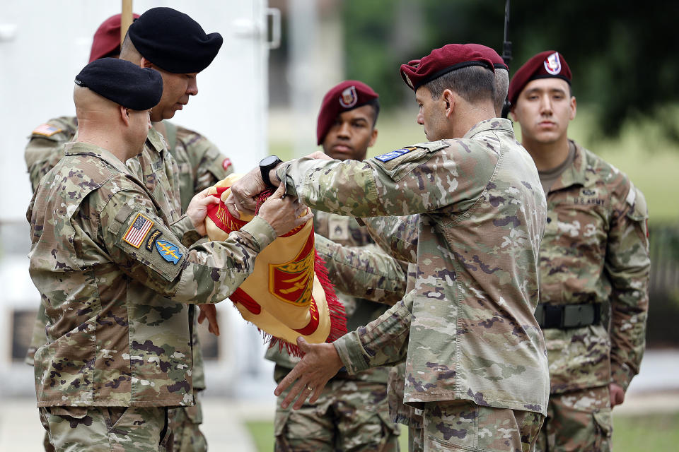 Lt. Gen. Christopher T. Donahue, front right, takes part of the Casing of the Colors during a renaming ceremony Friday, June 2, 2023, in Fort Liberty, N.C. The U.S. Army changed Fort Bragg to Fort Liberty as part of a broader initiative to remove Confederate names from bases. (AP Photo/Karl B DeBlaker)