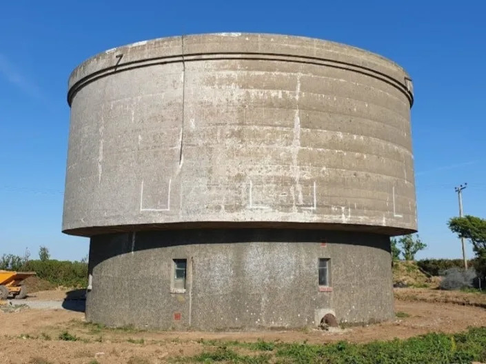 Before image of the water tank's exterior.