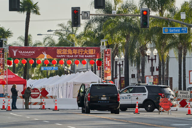 Monterey Park police cars block the intersection near the Star Dance Studio