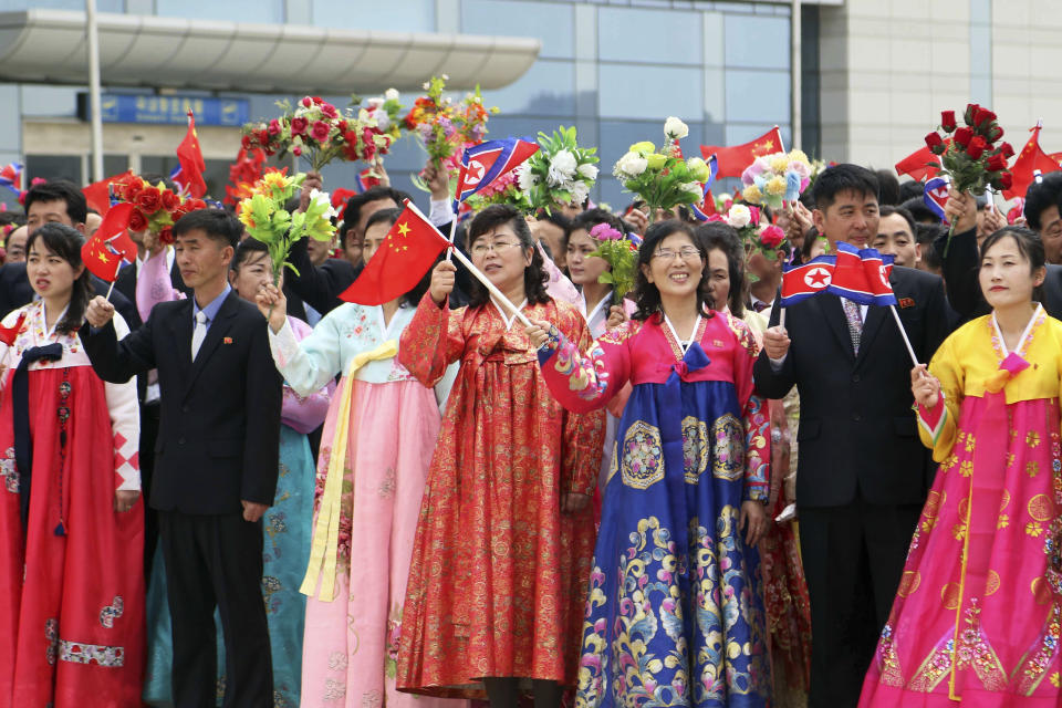 Pyongyang citizens welcome a Chinese delegation headed by Zhao Leji, chairman of the National People’s Congress and considered the No. 3 official in the ruling Communist Party, as they arrive at the Pyongyang International Airport in Pyongyang, North Korea, Thursday, April 11, 2024. (AP Photo/Cha Song Ho)