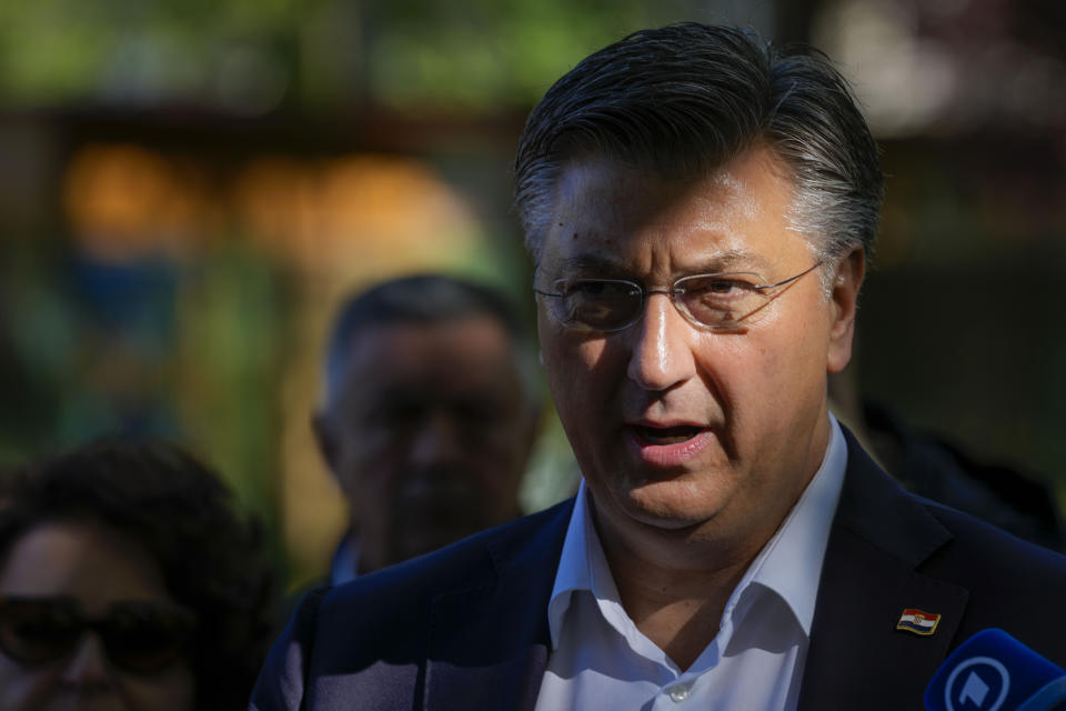 Prime Minister incumbent Andrej Plenkovic speaks to the media after casting his ballot at a polling station in Zagreb, Croatia, Wednesday, April 17, 2024. Croatia is voting in a parliamentary election after a campaign that centered on a bitter rivalry between the president and prime minister of the small European Union and NATO member. (AP Photo/Darko Vojinovic)