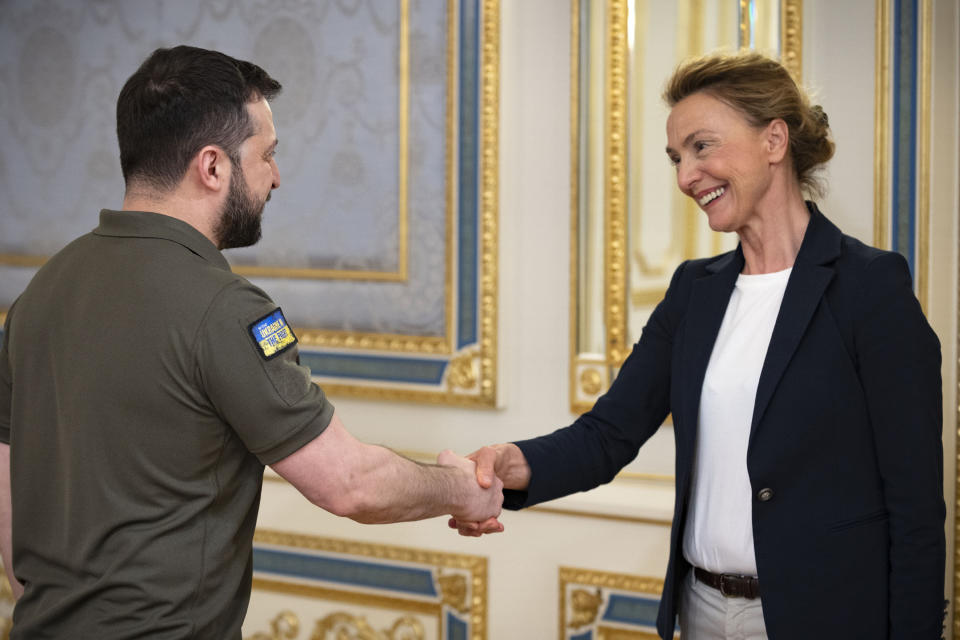 In this handout photo provided by the Ukrainian Presidential Press Office, Ukrainian President Volodymyr Zelenskyy, left, greets Secretary General of the Council of Europe Marija Pejcinovic Buric in Kyiv, Ukraine, Monday, May 9, 2022. (Ukrainian Presidential Press Office via AP)