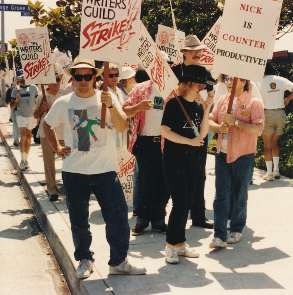 Manny Coto (and Harlan Ellison, far right) on the WGA picket line in 1988.