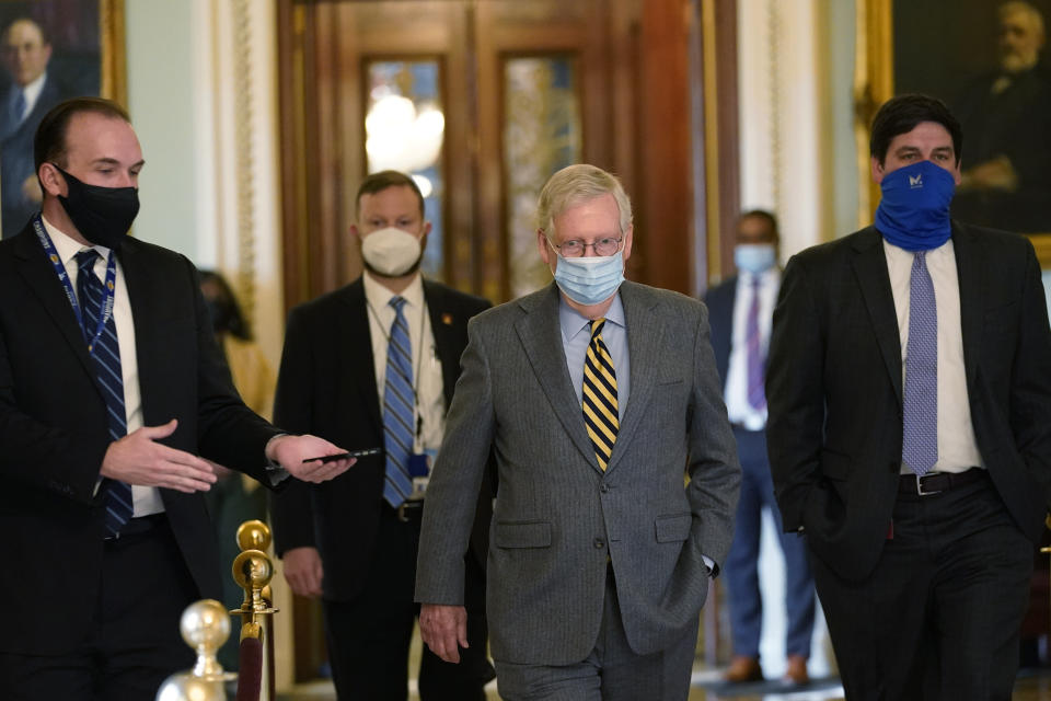 Senate Majority Leader Mitch McConnell of Ky., walks off of the Senate floor on Capitol Hill in Washington, Wednesday, Dec. 30, 2020. (AP Photo/Susan Walsh)