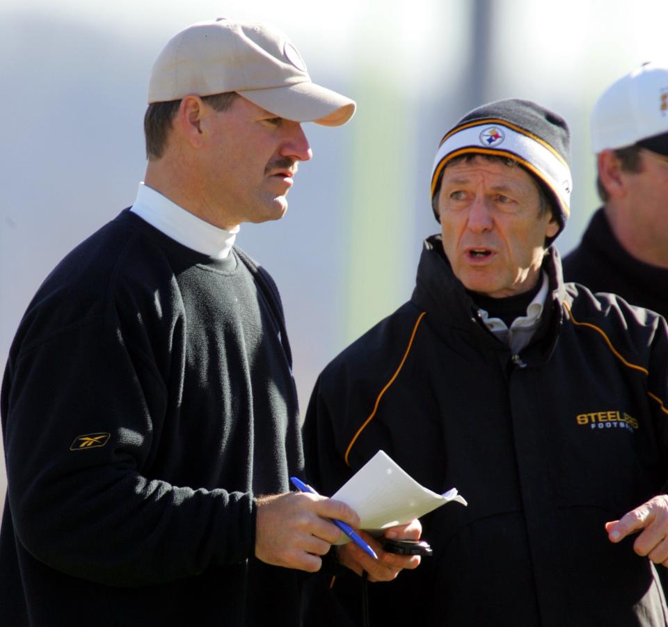 Steelers head coach Bill Cowher, left, talks with defensive coordinator Dick Lebeau during a workout in Pittsburgh, Thursday, Jan. 19, 2006.