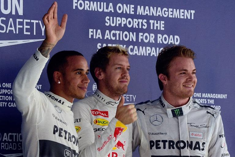 Sebastian Vettel (C) has tipped Nico Rosberg (R) and Lewis Hamilton as joint favourites to win the Forumla One world title