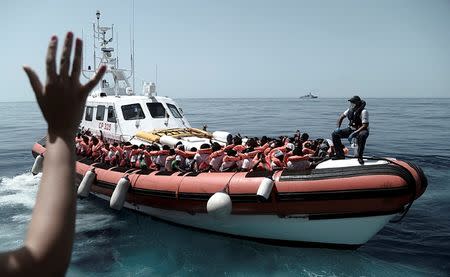 Migrants are seen after being rescued by MV Aquarius, a search and rescue ship run in partnership between SOS Mediterranee and Medecins Sans Frontieres in the central Mediterranean Sea, June 12, 2018. Karpov / SOS Mediterranee/Handout via REUTERS