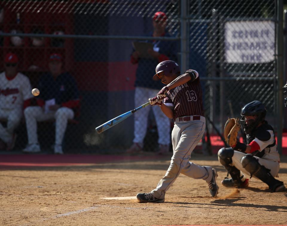 Arlington's Eric Santaella connects with a pitch against Ketcham during a Section 1 Class AA baseball quarterfinal on May 17, 2023.