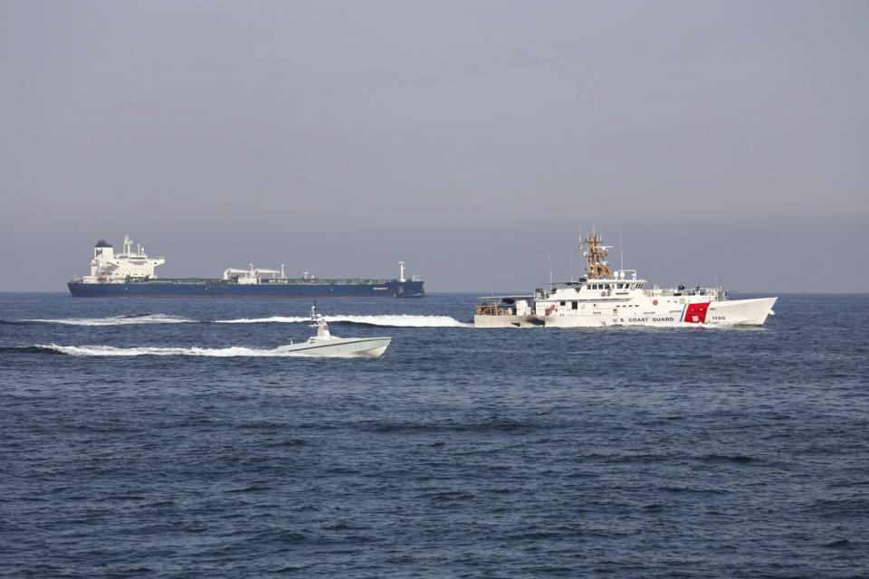 A U.S. Navy L3 Harris Arabian Fox MAST-13 drone boat and the U.S. Coast Guard cutter USCGC John Scheuerman transit the Strait of Hormuz on Wednesday, April 19, 2023. The U.S. Navy sailed its first drone boat through the strategic Strait of Hormuz on Wednesday, a crucial waterway for global energy supplies where American sailors often faces tense encounters with Iranian forces. (Information Systems Technician 1st Class Vincent Aguirre/U.S. Coast Guard via AP)