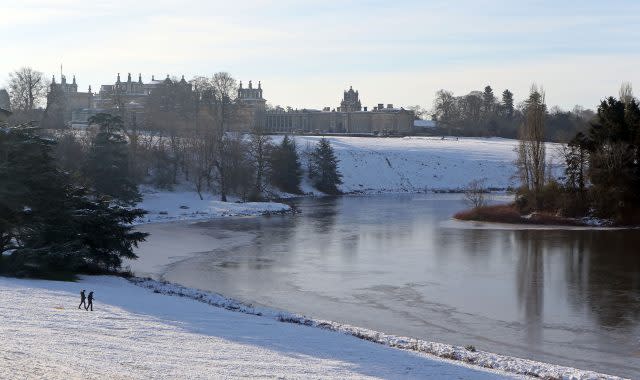 The stately home also had thick ice visible in its pond  (Steve Parsons/PA)