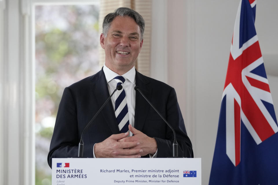 Deputy Prime Minister of Australia and Minister for Defense Richard Marles smiles during a joint press conference with French Defense Minister Sebastien Lecornu Thursday, Sept. 1, 2022 in Brest, Brittany. After coming to power in May elections, Australian Prime Minister Anthony Albanese's Labor Party government announced it had agreed to pay France's Naval Group a 555-million-euro ($583 million) settlement for breaking the contract for French-made diesel-electric submarines. (AP Photo/Francois Mori)