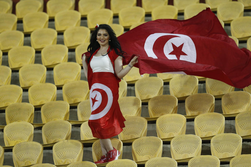 Tunisian fan stands before the African Cup of Nations third place soccer match between Tunisia and Nigeria in Al Salam stadium in Cairo, Egypt, Wednesday, July 17, 2019. (AP Photo/Ariel Schalit)