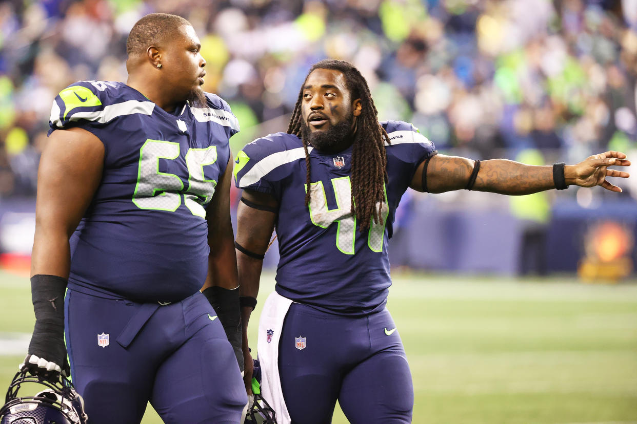 Gabe Jackson #66 and Alex Collins #41 (Abbie Parr / Getty Images)