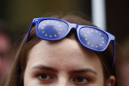 A supporter of Carsten Meyer-Heder, Germany's Christian Democratic Union party (CDU) top candidate for the German city-state of Bremen parliamentary elections reacts after first election polls were published in Bremen, Germany, May 26, 2019. REUTERS/Wolfgang Rattay