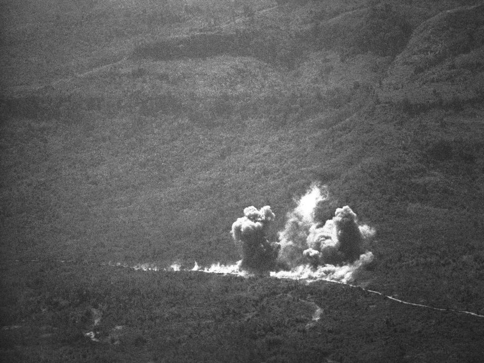 Smoke billows from bomb blasts along the Ho Chi Minh Trail in Laos in 1971.