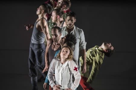 Opera singers and dancers perform on stage during a rehearsal of "Shell Shock", an opera marking the centenary of World War One, at La Monnaie Theatre in Brussels October 17, 2014, in this handout courtesy of La Monnaie. REUTERS/Filip Van Roe/La Monnaie/Handout via Reuters