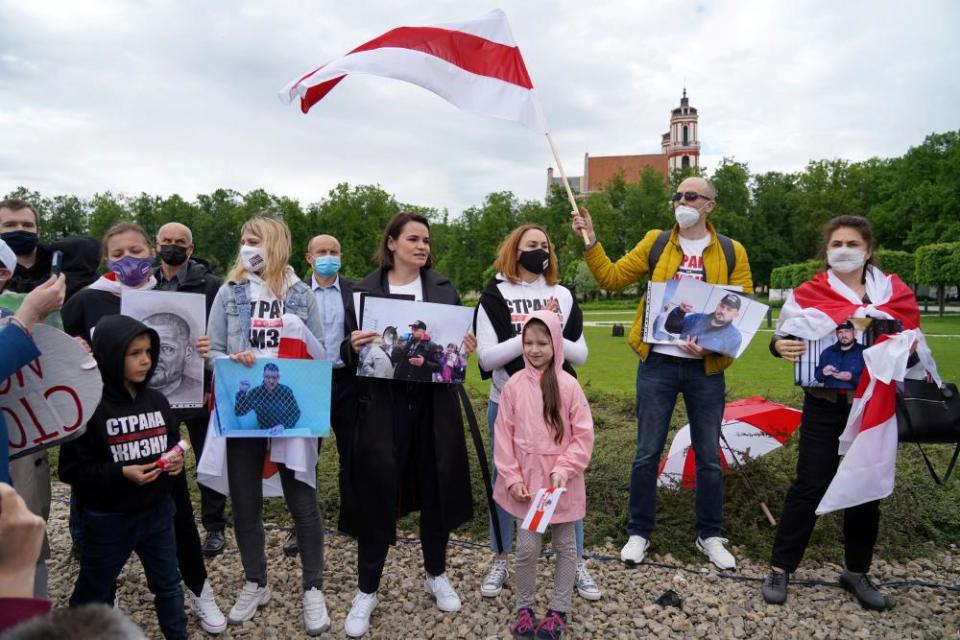 Belarus opposition leader Sviatlana Tsikhanouskaya holds a picture of her husband, Syarhei Tsikhanouski, during a “Belarus support day” protest in Vilnius, Lithuania May 2021.