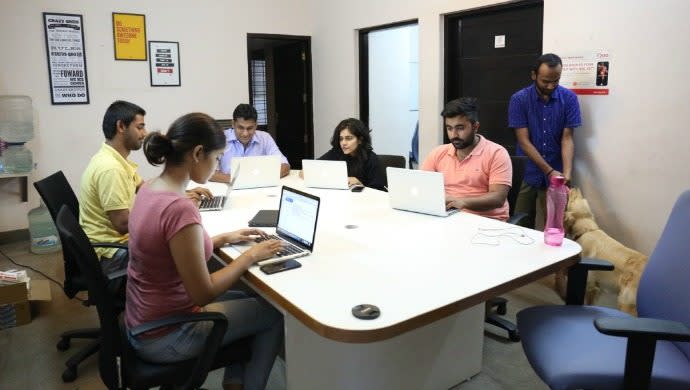 Arya with her employees in the office