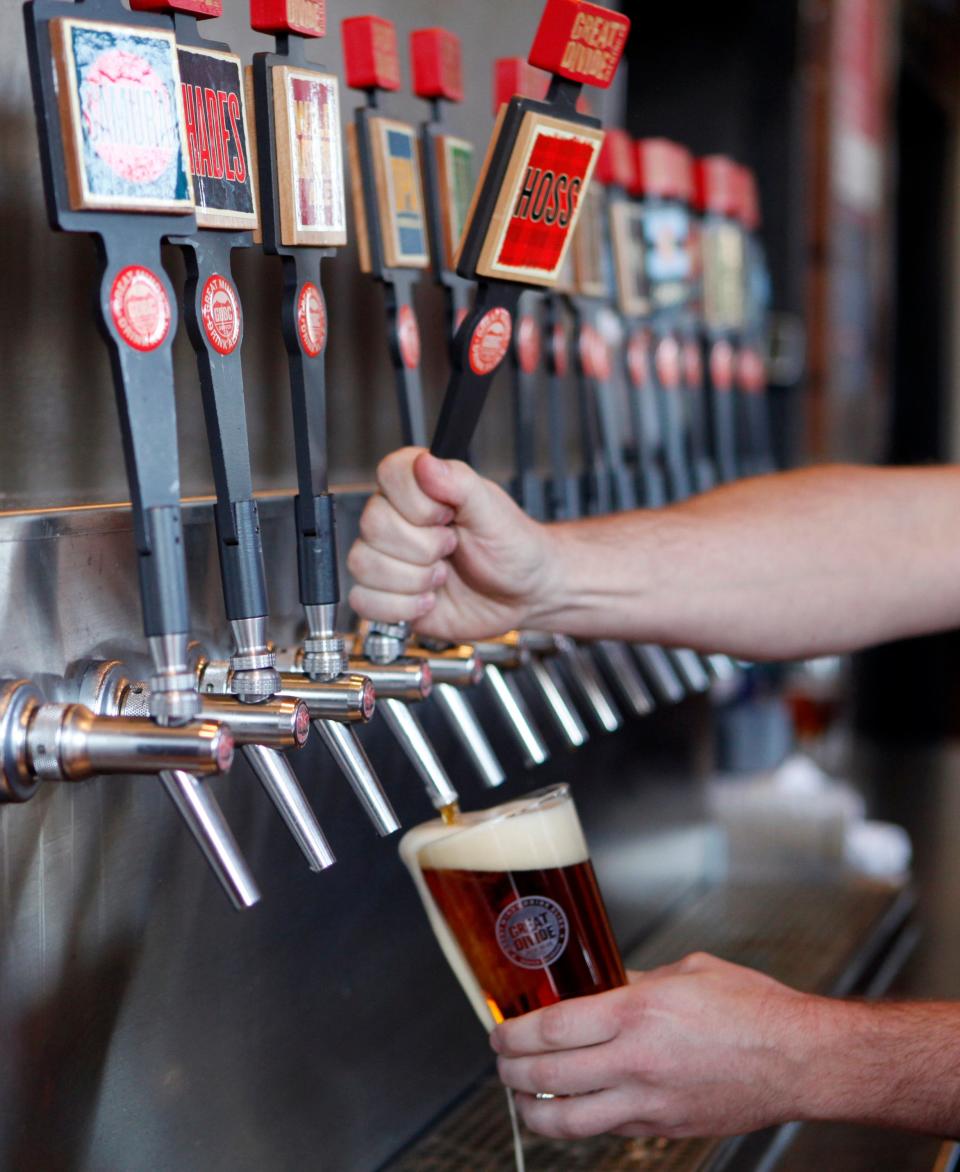 This photo taken on Dec. 7, 2012 shows a glass of beer being drawn from one of 16 taps at the Great Divide Brewery in Denver.