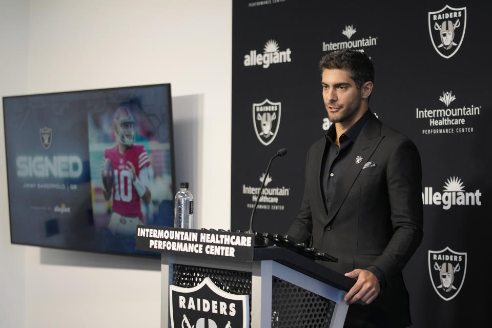Las Vegas Raiders quarterback Jimmy Garoppolo takes questions at an NFL football news conference Friday, March 17, 2023, in Henderson, Nev. (AP Photo/John Locher)