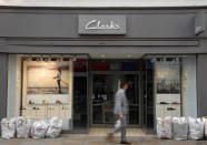 A man walks past a Clarks shoe shop in west London, Britain, May 21, 2018. REUTERS/Toby Melville