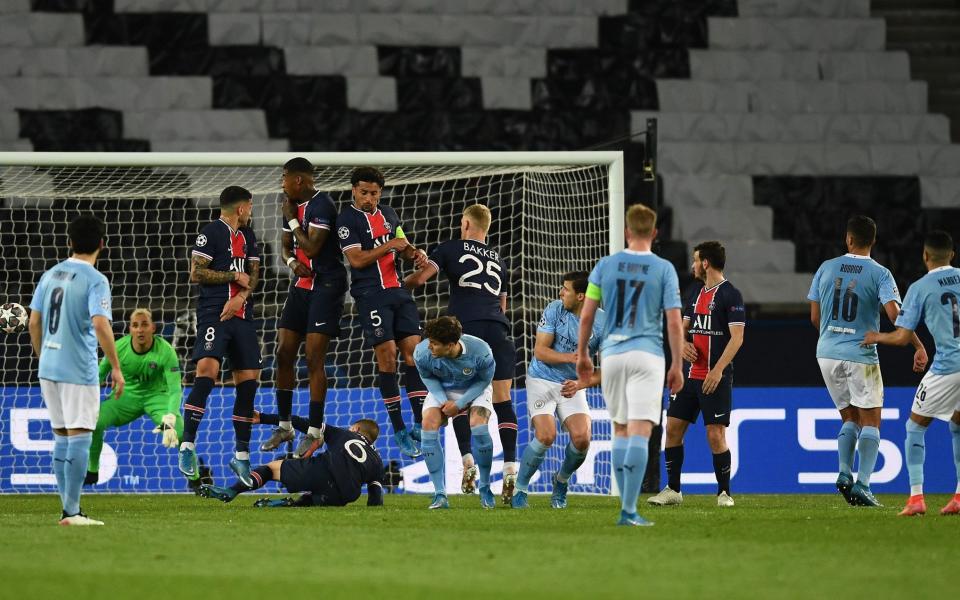 Leandro Paredes, Presnel Kimpembe, Marquinhos and Mitchel Bakker of Paris Saint-Germain fail to stop a free kick by Riyad Mahrez of Manchester City leading to him scoring their side's second goal during the UEFA Champions League Semi Final First Leg  - Alexander Scheuber - UEFA/UEFA via Getty Images