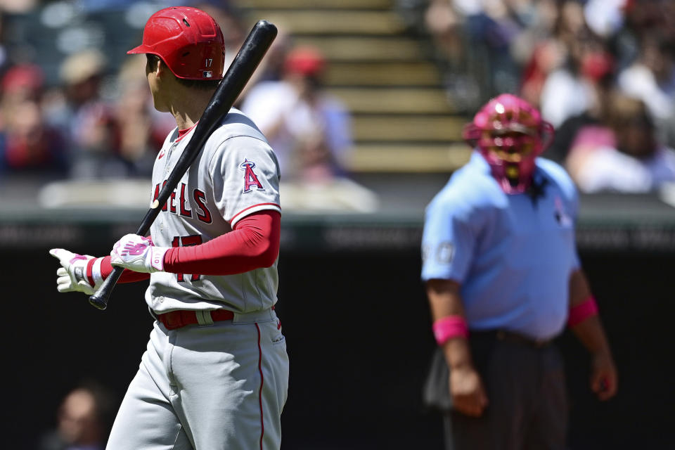 Los Angeles Angels' Shohei Ohtani reacts after striking out during the fourth inning of a baseball game against the Cleveland Guardians, Sunday, May 14, 2023, in Cleveland. (AP Photo/David Dermer)