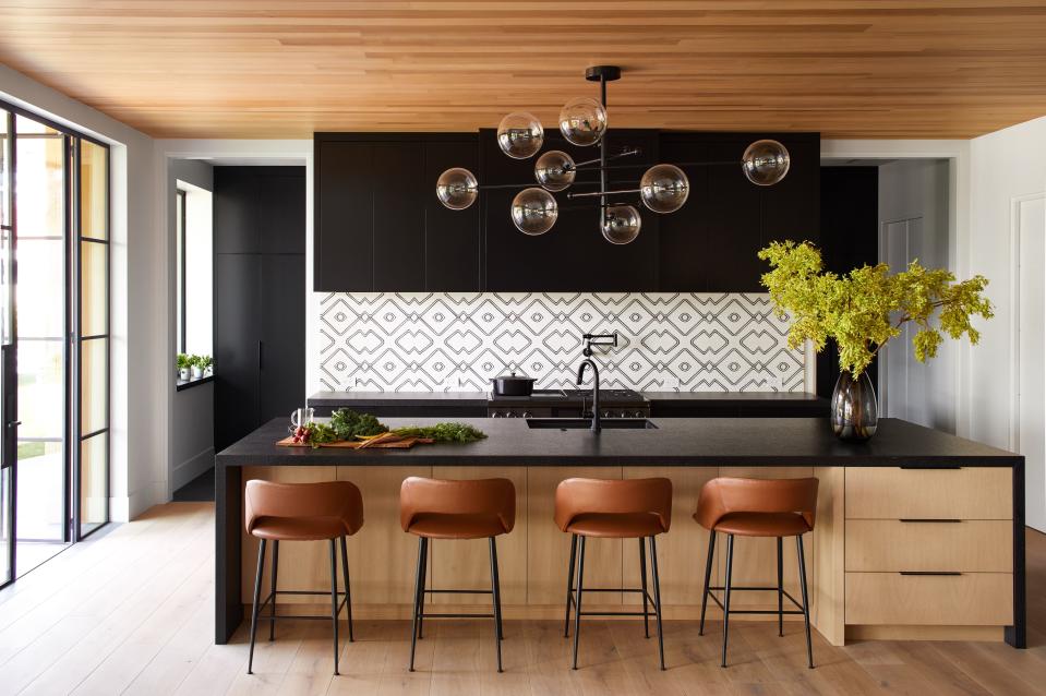 Modern sleek kitchen with minimalist pendant lighting