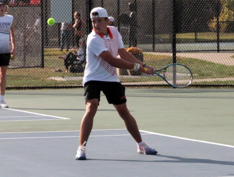 Christian Perry eyes a return shot in his matchup on Tuesday afternoon against Three Rivers.