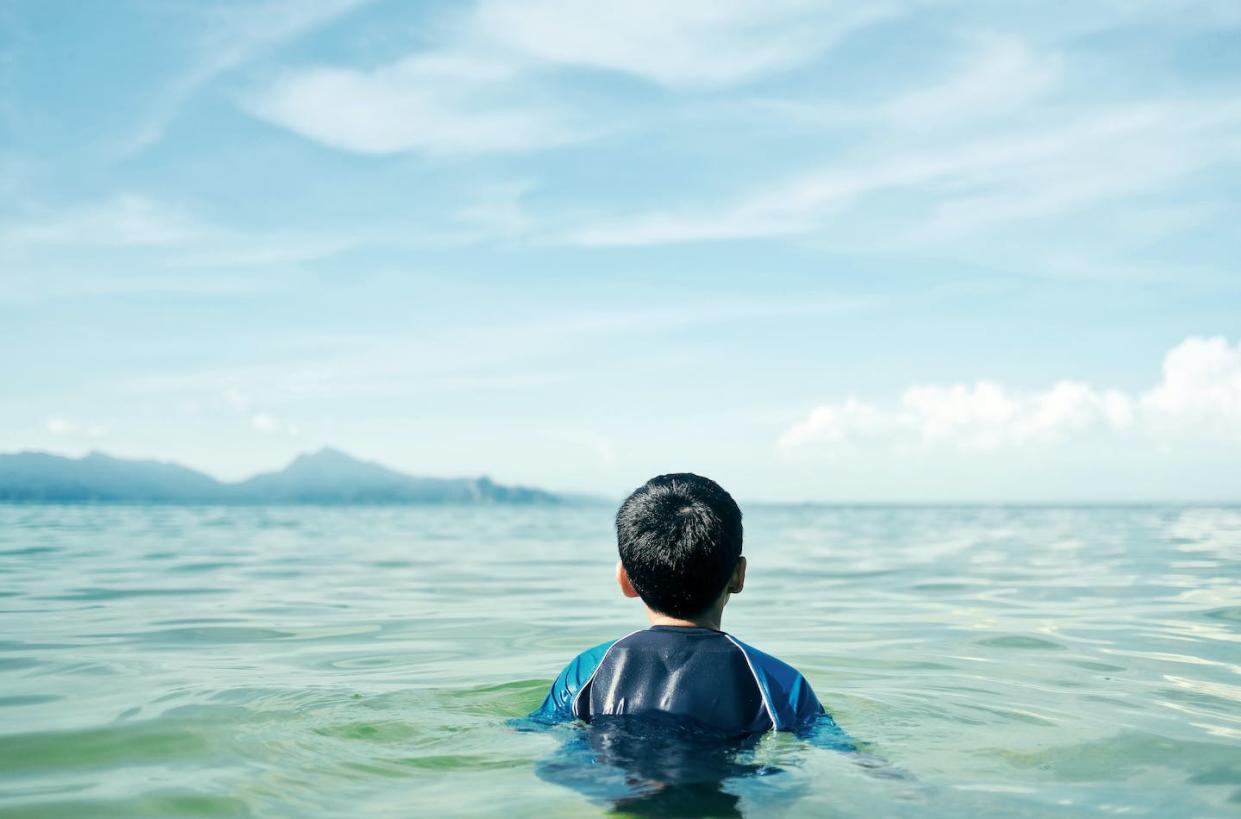 There are a lot of people, but the oceans are very big. <a href="https://www.gettyimages.com/detail/photo/rear-view-of-boy-in-sea-against-sky-royalty-free-image/947393052" rel="nofollow noopener" target="_blank" data-ylk="slk:Rosley Majid/EyeEm via Getty Images;elm:context_link;itc:0;sec:content-canvas" class="link ">Rosley Majid/EyeEm via Getty Images</a>