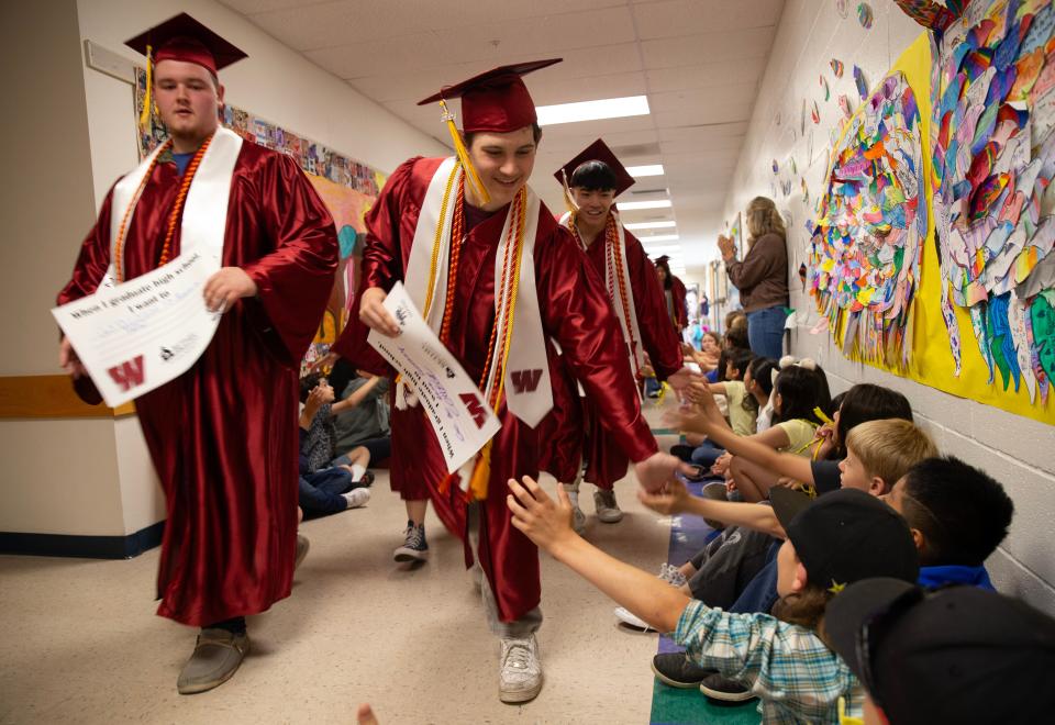 Willamette and Kalapuya graduates celebrate their achievement with students at Prairie Mountain School on June 6.