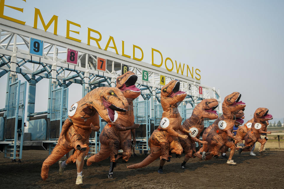 Racers, including eventual winner Ocean Kim (5), leave the gates for the championship race during the "T-Rex World Championship Races" at Emerald Downs in Auburn, Wash., on Aug. 20, 2023. (AP Photo/Lindsey Wasson)