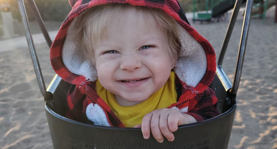 Ollie Garza-Pena, 2, is pictured in a swing.