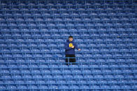 A spectator take his pace in the stands ahead of the English Premier League soccer match between Chelsea and Liverpool at Stamford Bridge in London, Sunday, Jan. 2, 2022. (AP Photo/Matt Dunham)