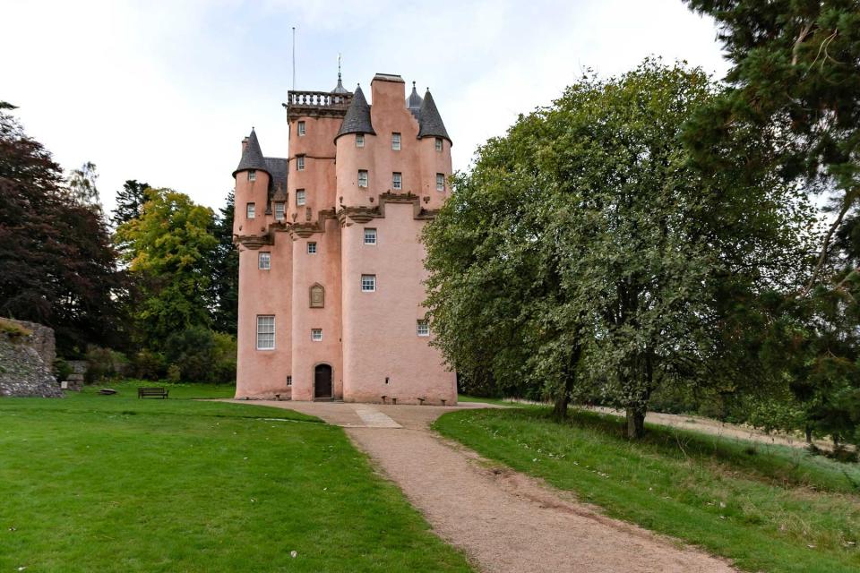 Nestled on a picturesque hillside, the elegant pink tower of Craigievar Castle is spellbindingly beautiful,